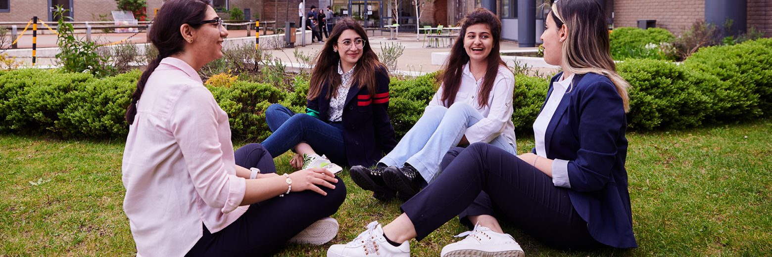 Students relaxing in the courtyard at at Abbey College Cambridge