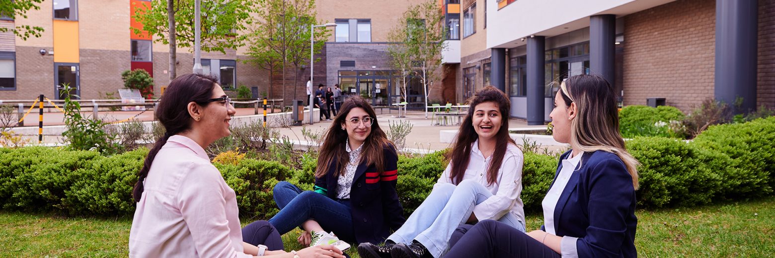 Female Students Relaxing In College