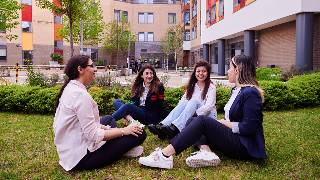 Iranian Students Relaxing In The Abbey College Cambridge Courtyard
