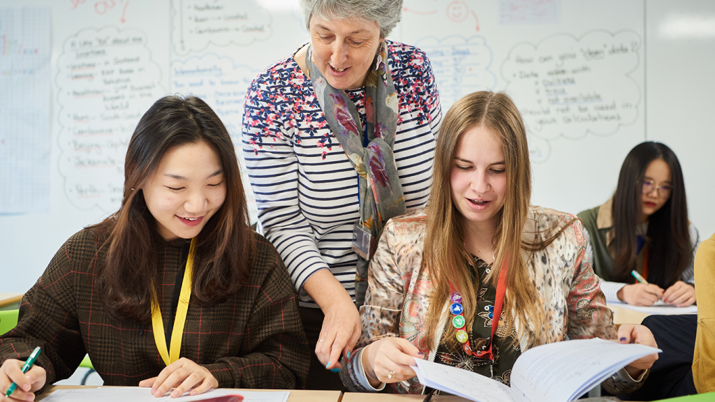 Teacher and Students In A Level Mathematics Class