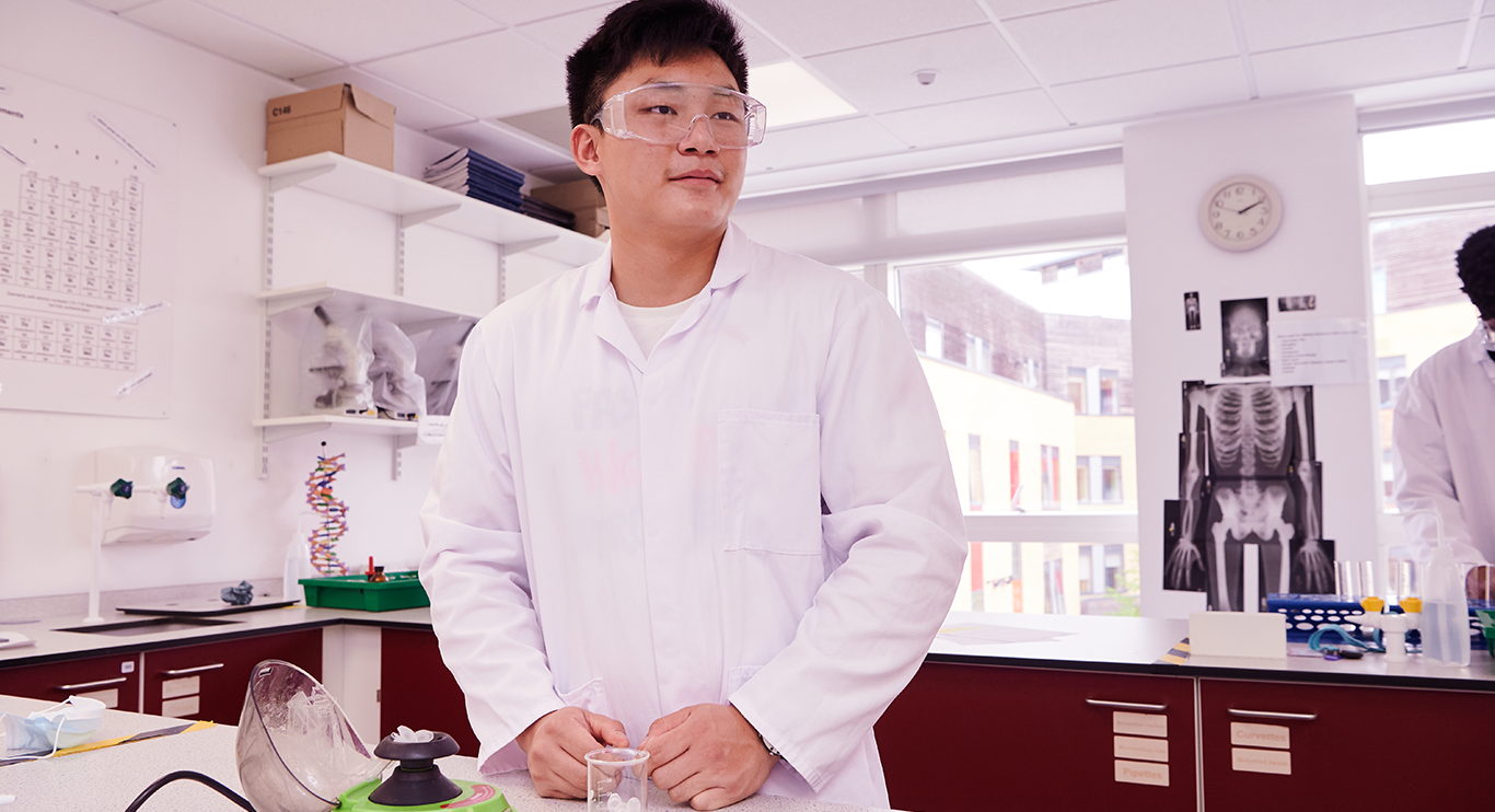 Abbey College Cambridge Male Student Working In Science Lab