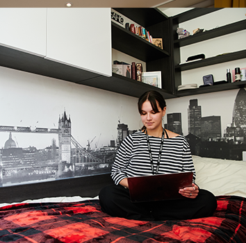 Student Working In Her Bedroom At DLD College London