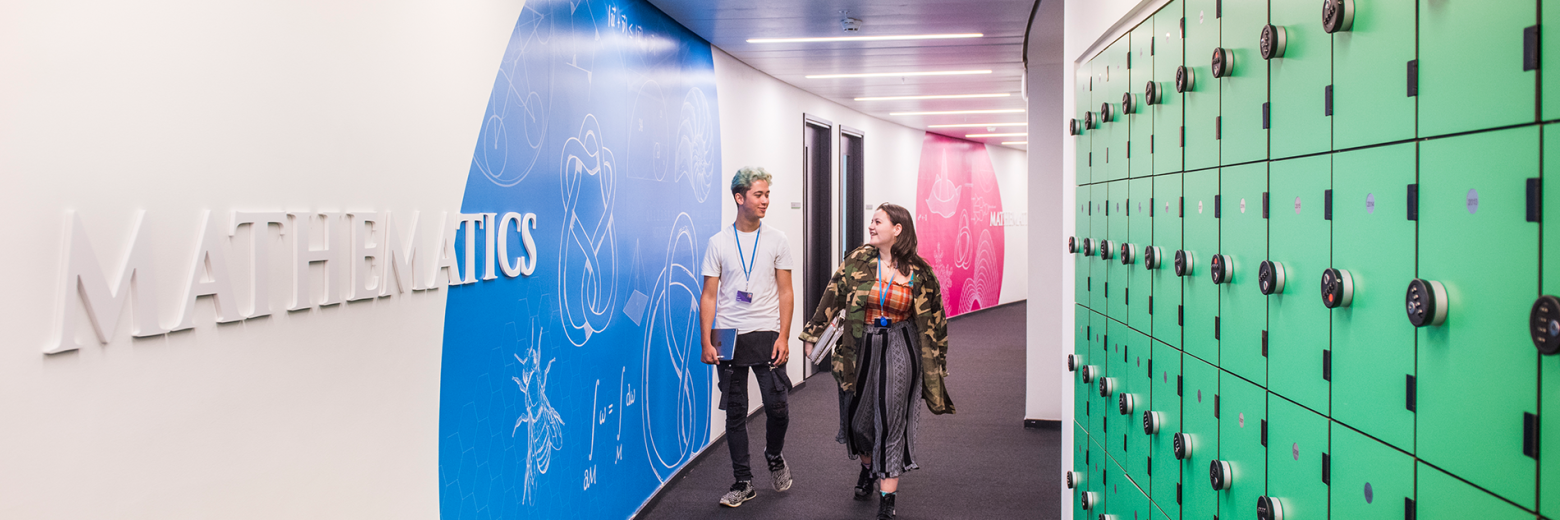 Students Walking In DLD College London Mathematics Corridoor