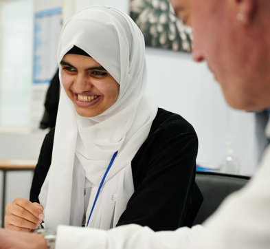 Female Student In Tutorial At Abbey College Manchester