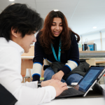 Students Working Together In The College Library