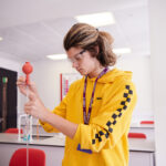 Student Performing Titration in the chemistry lab.