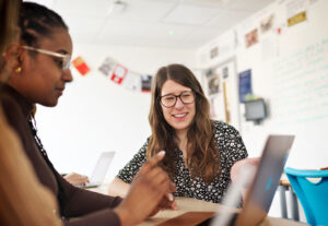 Female Student And Teacher In Psychology Class.