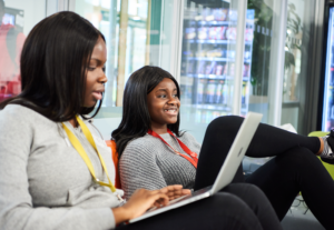Female Students Relaxing In The Common Room At Abbey College Cambridge
