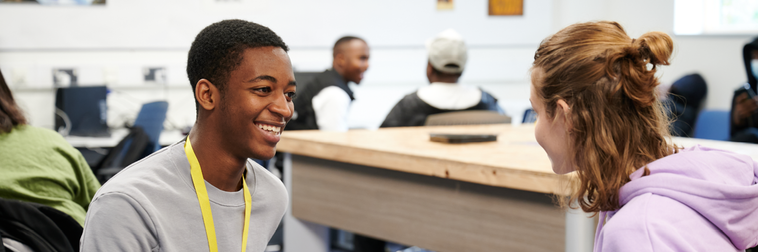 Students relaxing in the common room at Abbey College Cambridge