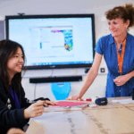 Female Chinese Student With Teacher