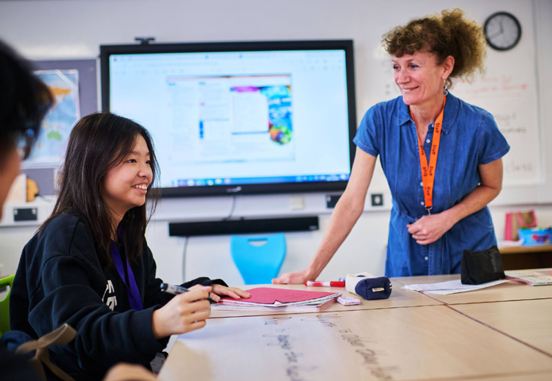 Female Chinese Student With Teacher