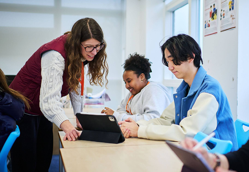 Male Chinese Student With Female Teacher In Psychology Class