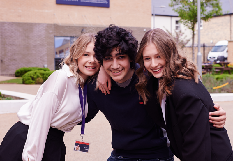 Students Realxing In The Courtyard At Abbey College Cambridge